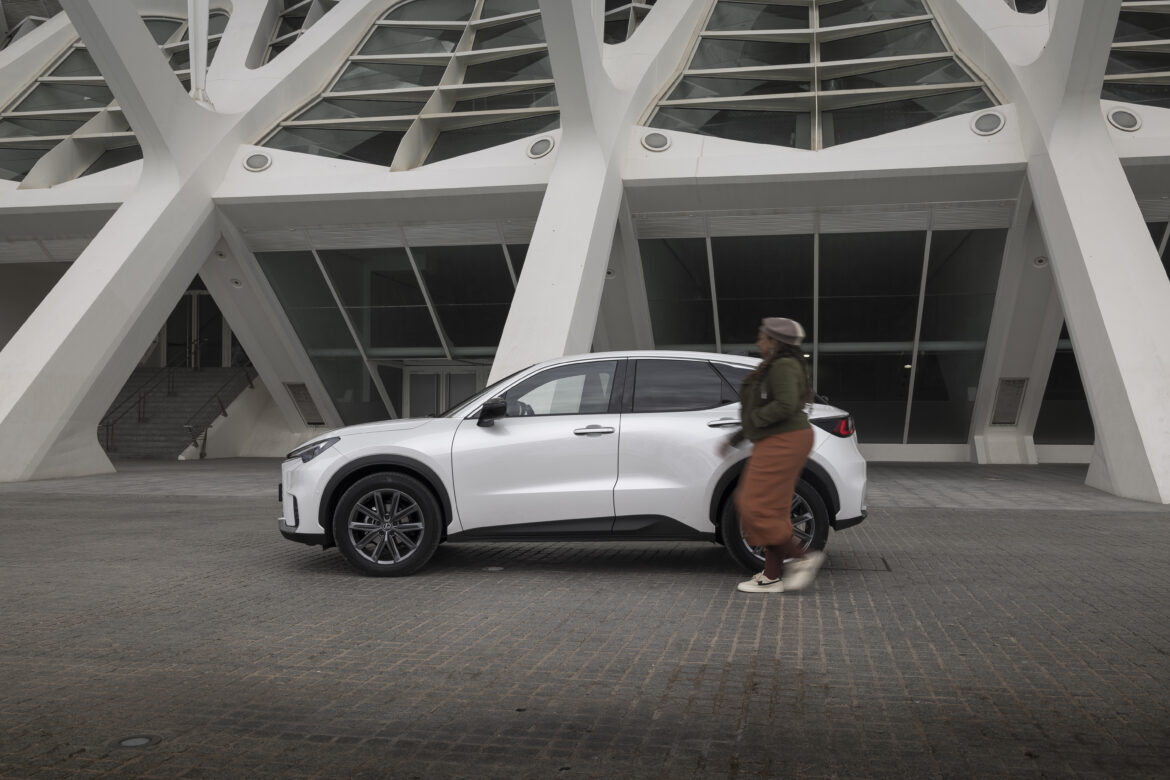 Eulanda walks alongside the new Lexus LBX Hybrid Crossover