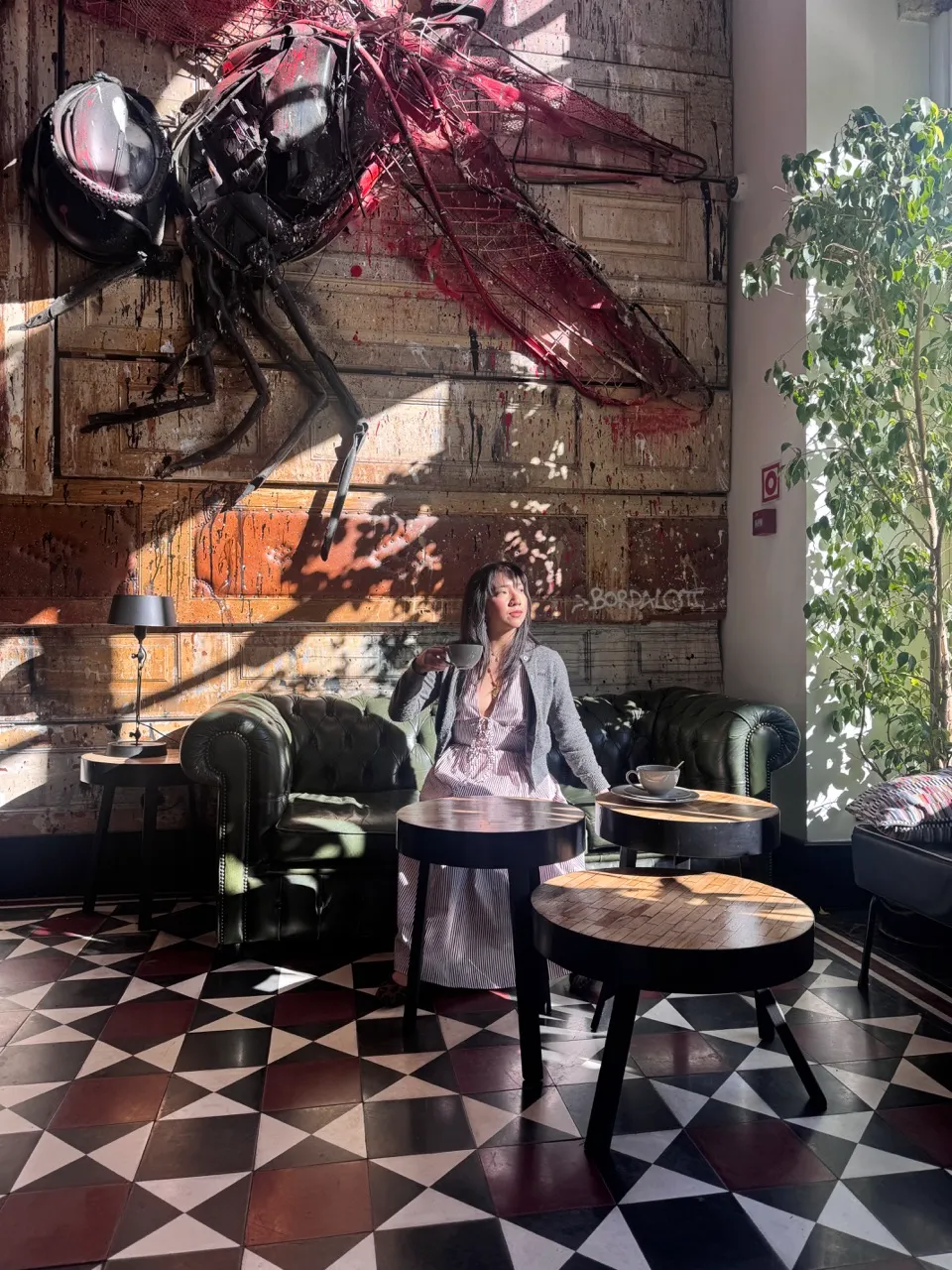 Hannah Tan enjoying the art-filled lobby of 1908 Lisboa Hotel, Lisbon's best boutique hotel