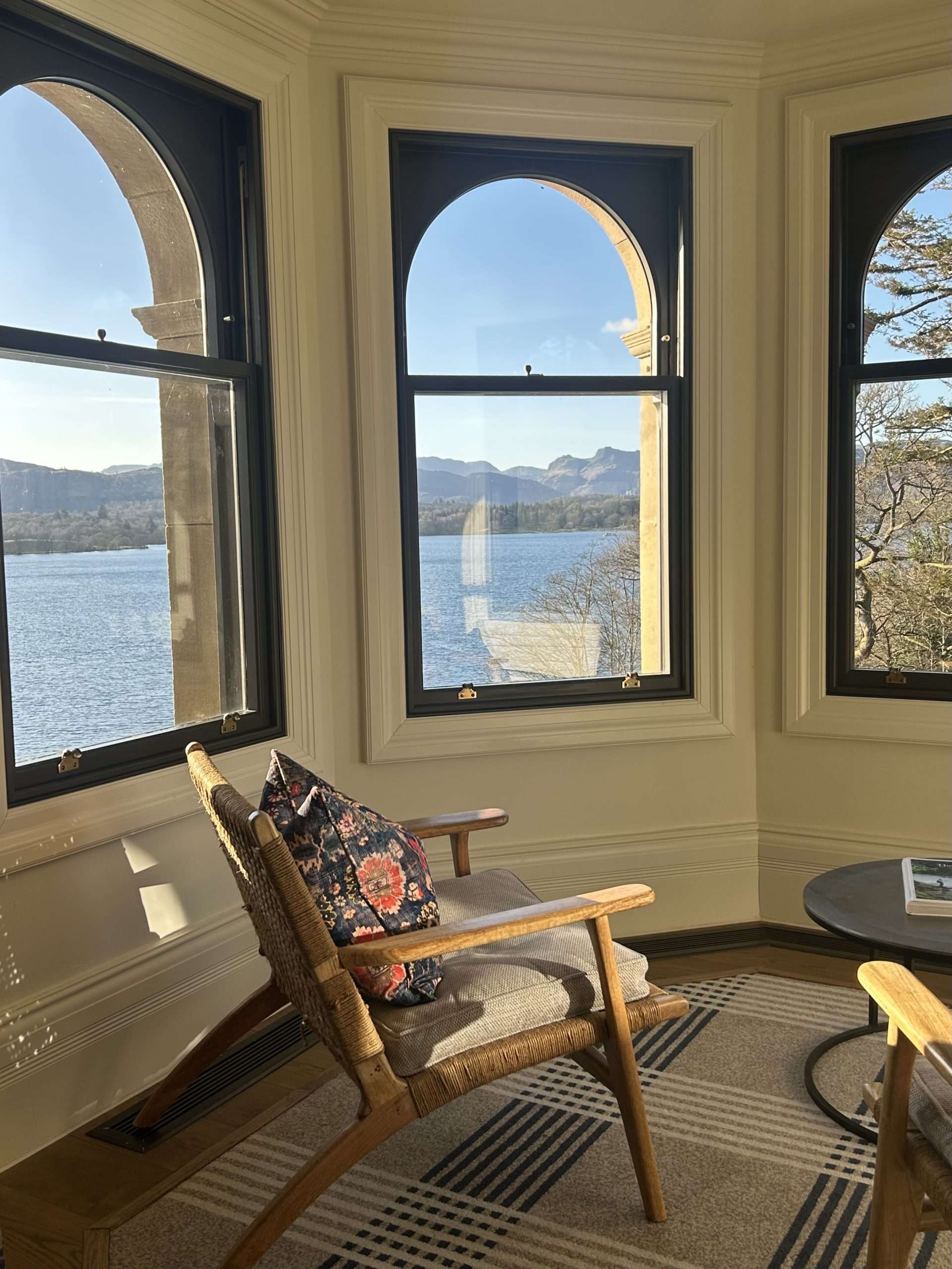 The turret living room at Langdale Chase Hotel. Armchairs look out over panoramic views of the lake.