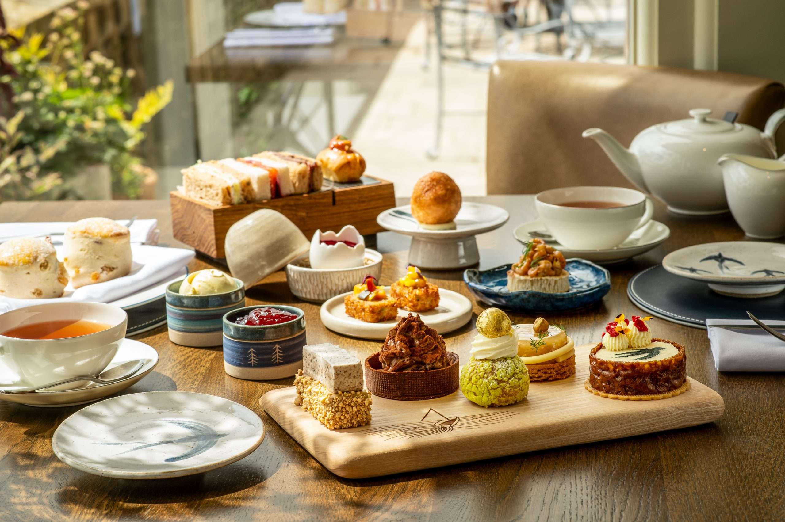 The Swallows and Amazons Afternoon Tea at Langdale Chase Hotel with themed patisserie and savouries.